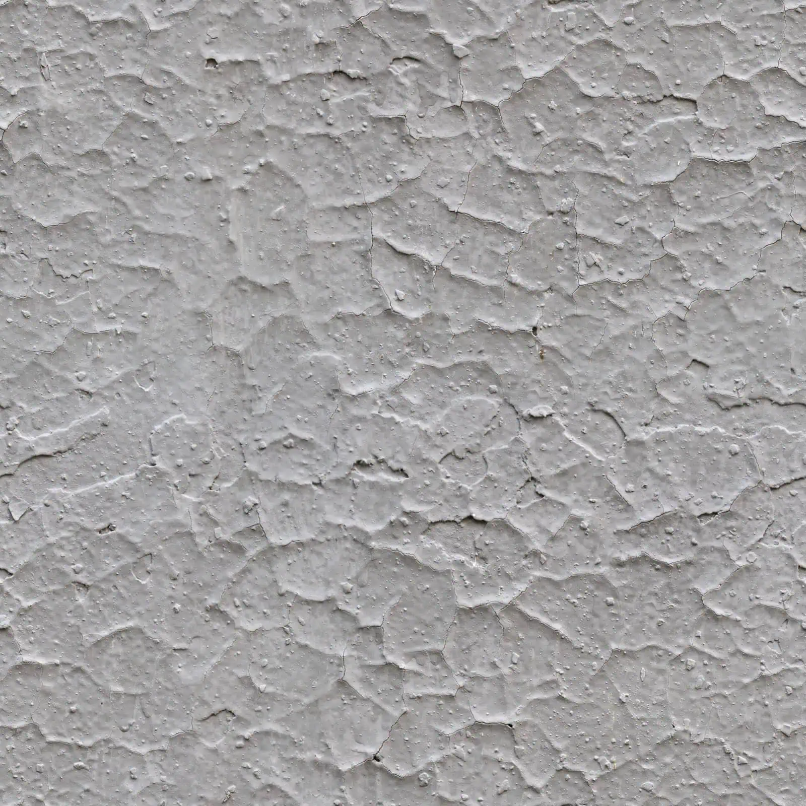 Drywall surface with textured white paint, showcasing professional wall installation.